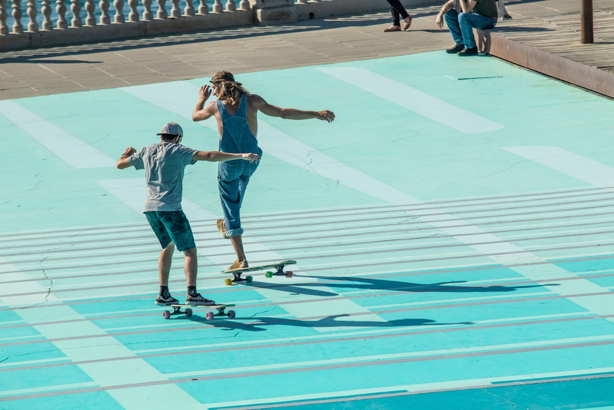 two men playing skateboard
