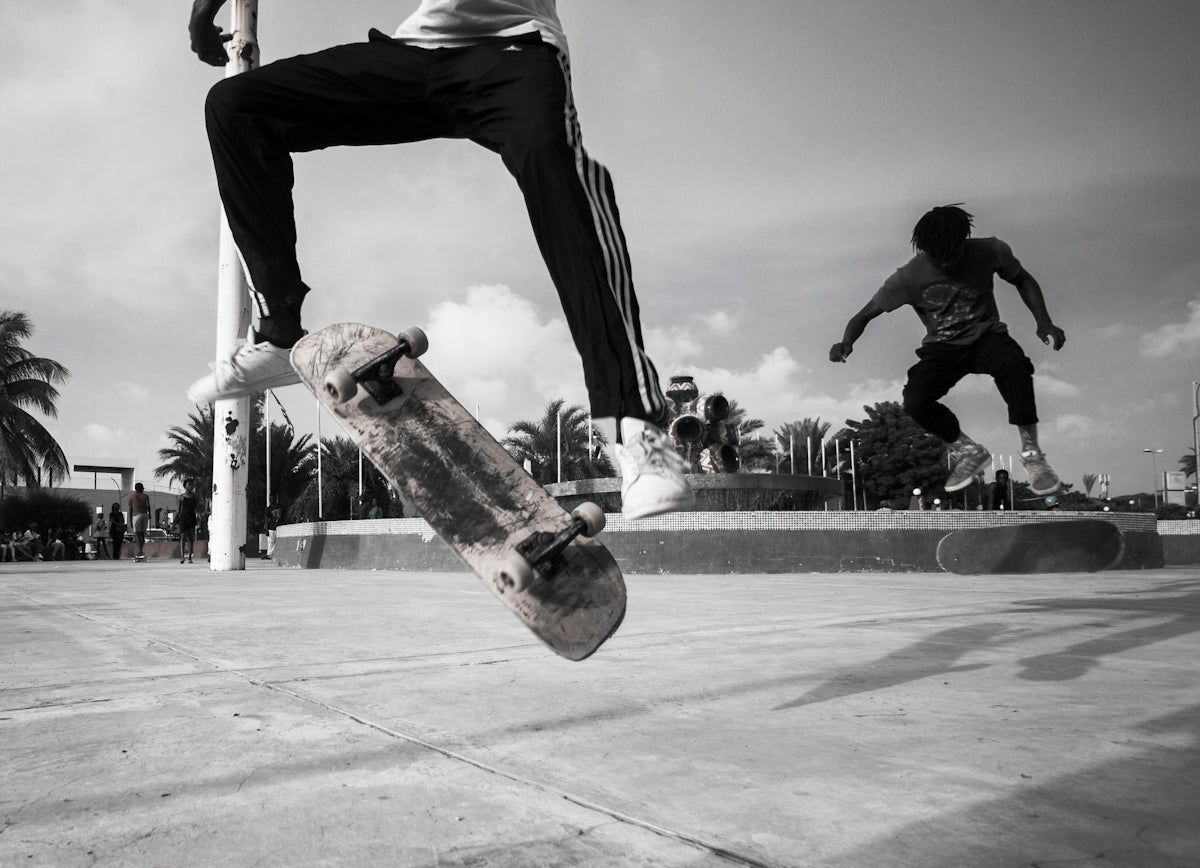 a man flying through the air while riding a skateboard