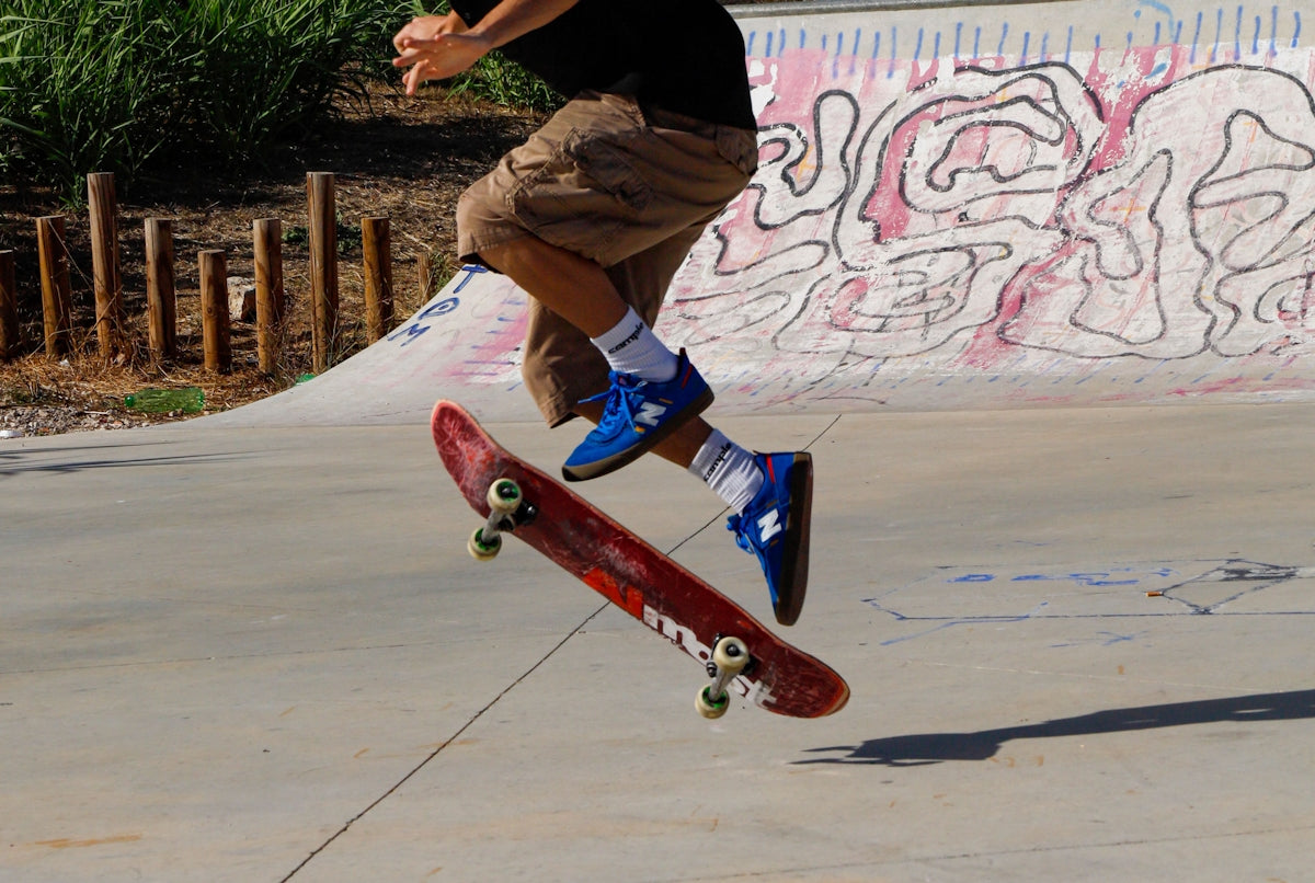 A man riding a skateboard up the side of a ramp