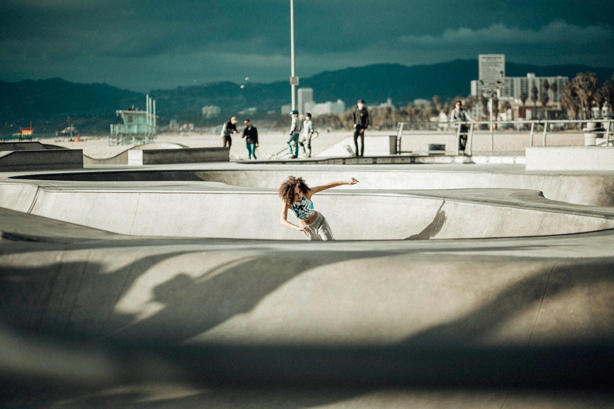 A person riding a skateboard at a skate park