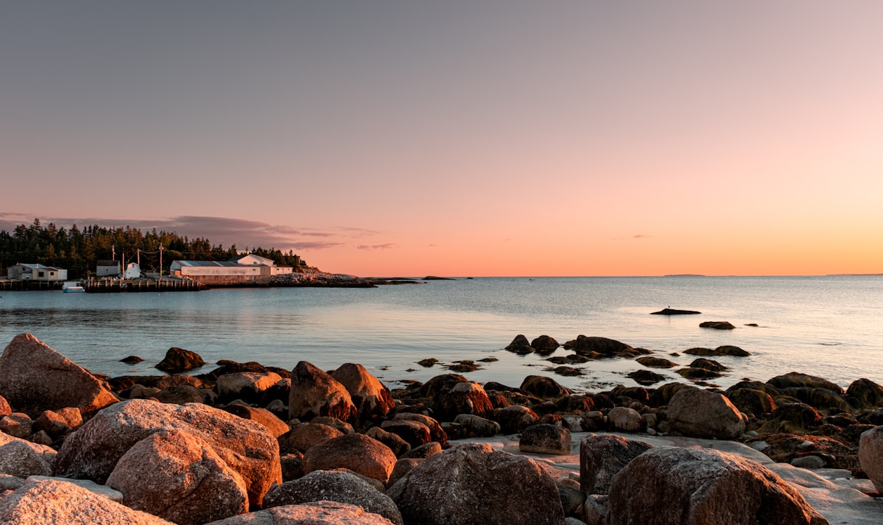 Rocky coastal landscape at sunset — evoking the Cap de Creus coastline of Catalonia in Dali's Persistence of Memory